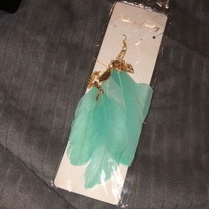 Brand new teal feather earrings